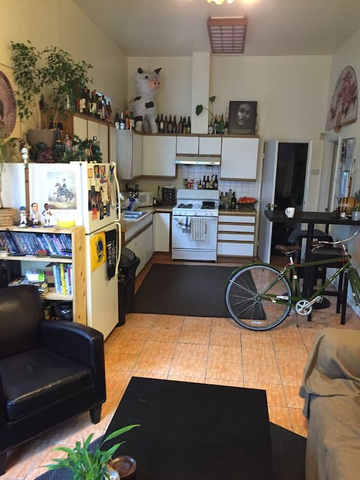 Living room offers love seat and couch, full kitchen (oven, microwave, fridge)