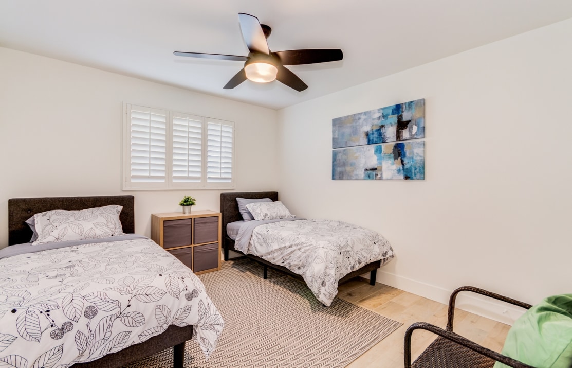 Sleep like a baby in bedroom #3 with 2 single beds and extra comfy mattresses topped with Charisma Bedding!