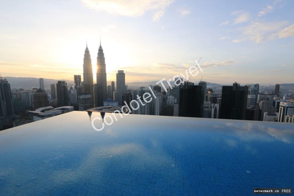 infinity-pool sun rise view over KLCC Twin Tower...
