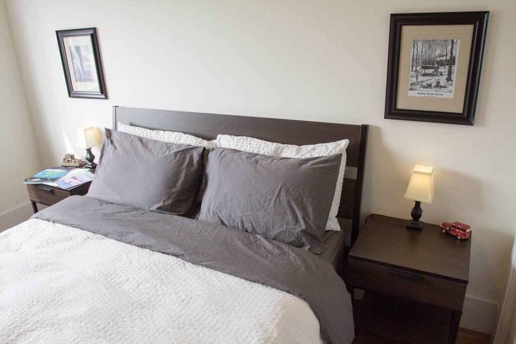 This is your bedroom. New queen size bed and a variety of pillows to choose from, with one night stand on each side and a dresser for your personal belongings.