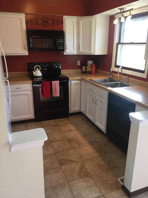 kitchen fully equipped with cooking necessities and new appliances