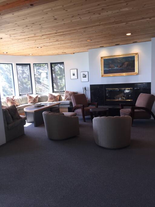 Living room with views and a fireplace