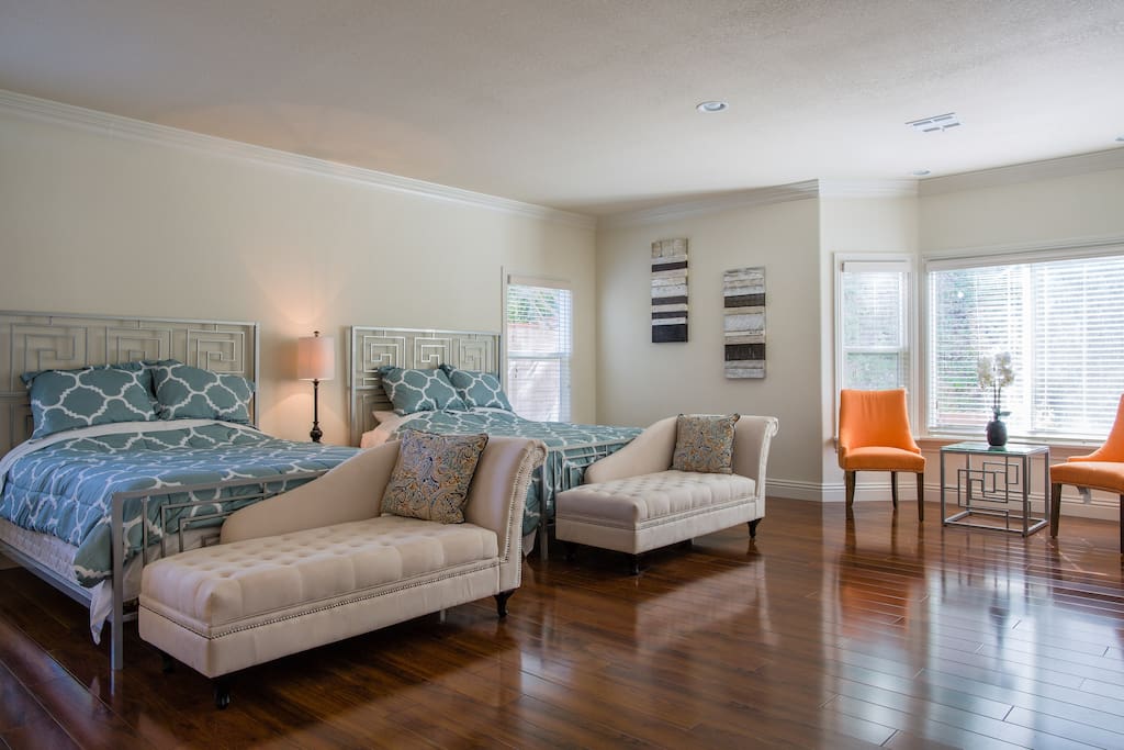 Room inside: two queen size beds, study area, rest area and bathroom