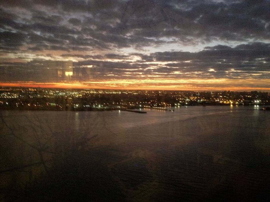 Living Room Window View of East River at Sunset and Brooklyn
