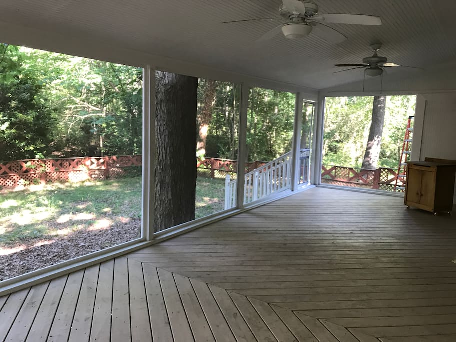 Large screened in deck with backyard access