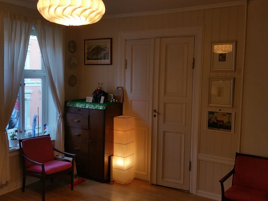 A different view of the living room, with entrance to the bedroom. The ceiling is really high, true to the style of the late 1800, when the building was constructed.