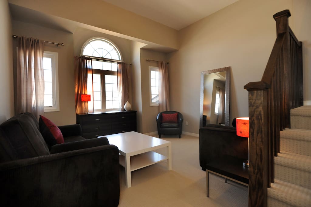 Living area with high ceiling