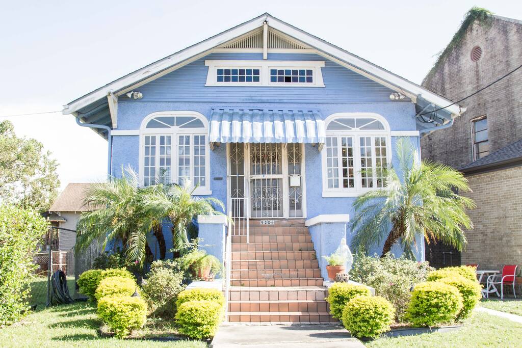 The little blue house next to the Church.
