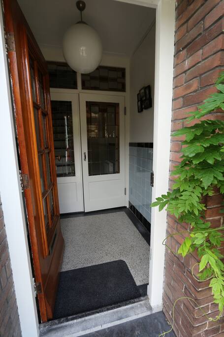Vestibule with draught excluder with stained glass