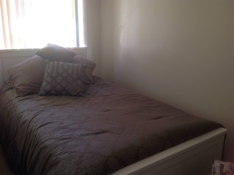 Clean bright room with large size single bed