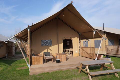 Luxurious and cozy safari tent with its own bathroom