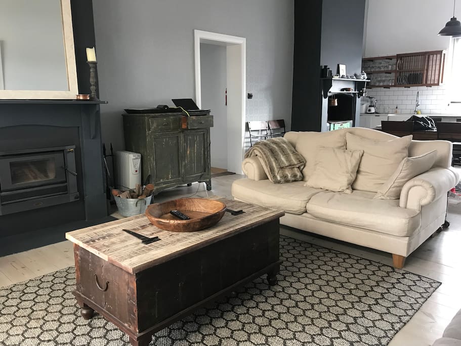 Open living space with two functioning fire places.