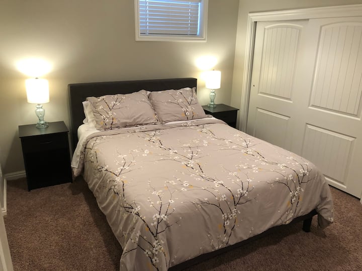 Downstairs 2nd bedroom with queen bed.  Access to master bath through laundry room.