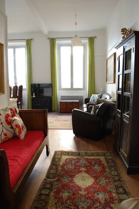 The reading nook has a daybed & bookcase