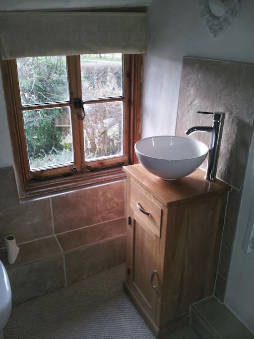 Newly fitted oak unit with basin