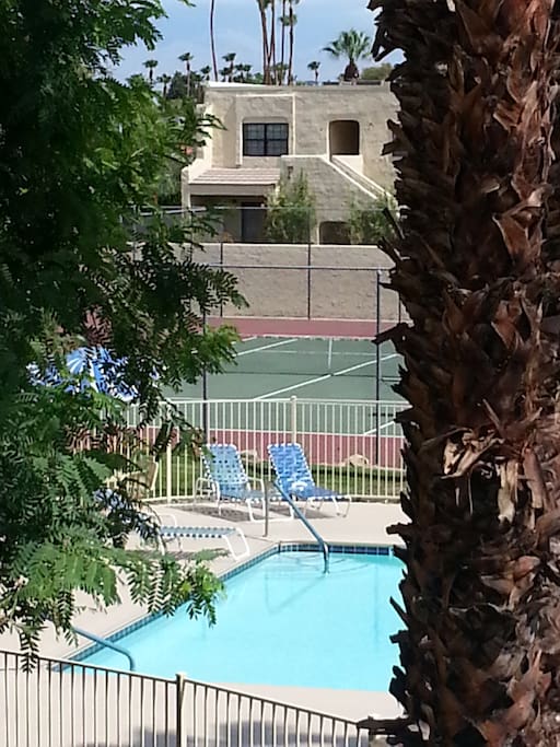 Tennis court just beyond pool