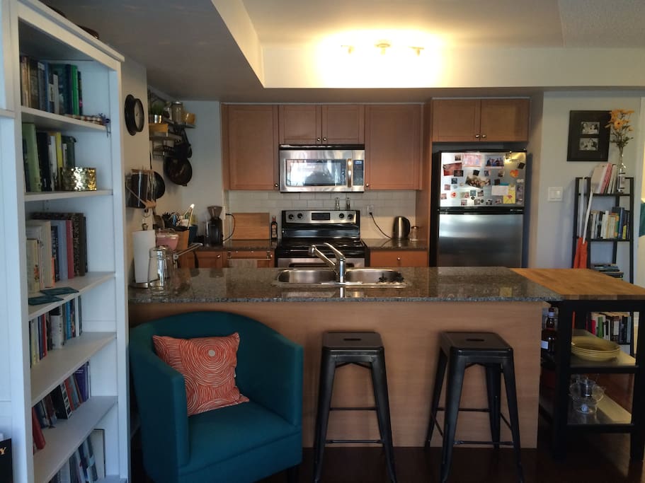Our open-concept kitchen has a dishwasher, microwave and great stove. It overlooks the living room.
