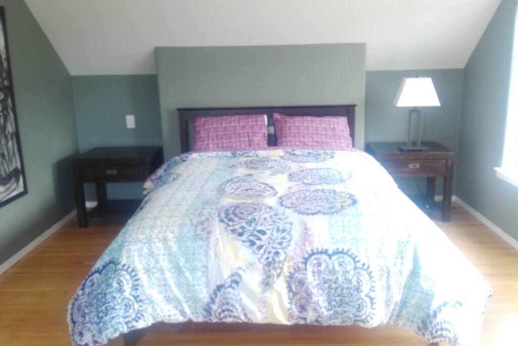 Master bedroom with ensuite. There is a private south facing balcony off the bedroom with views of the ocean and mountains.