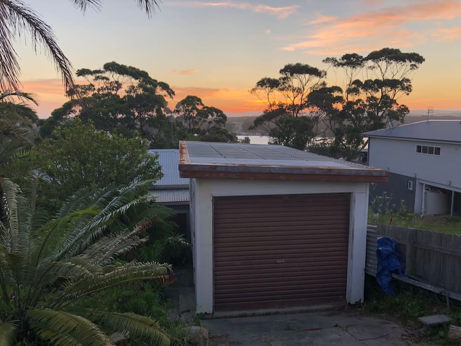 You'll have privacy and the whole property to yourself. This is the street we're on, and the house is below the garage you see. There's a bush path at the end of our street, that takes you to Racecourse Beach