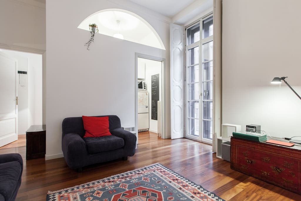 Living room, balcony and entrance to the kitchen