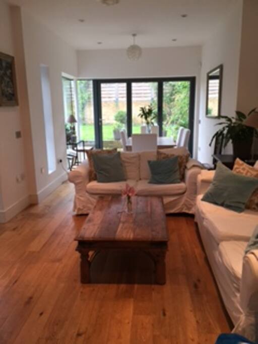 Living/Dining room.
Folding doors open to the garden with BBQ outdoor dining.