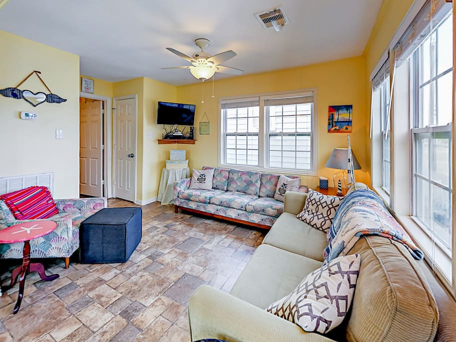 Unwind in the living room, which includes a convenient queen-size sleeper sofa.