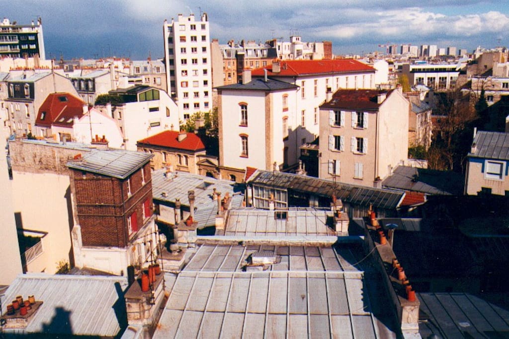 View looking East (streetside), from the main room balcony. This is the summer view...
