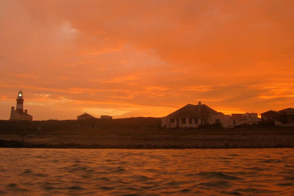 Southermost and the historic lighthouse at sunset.
