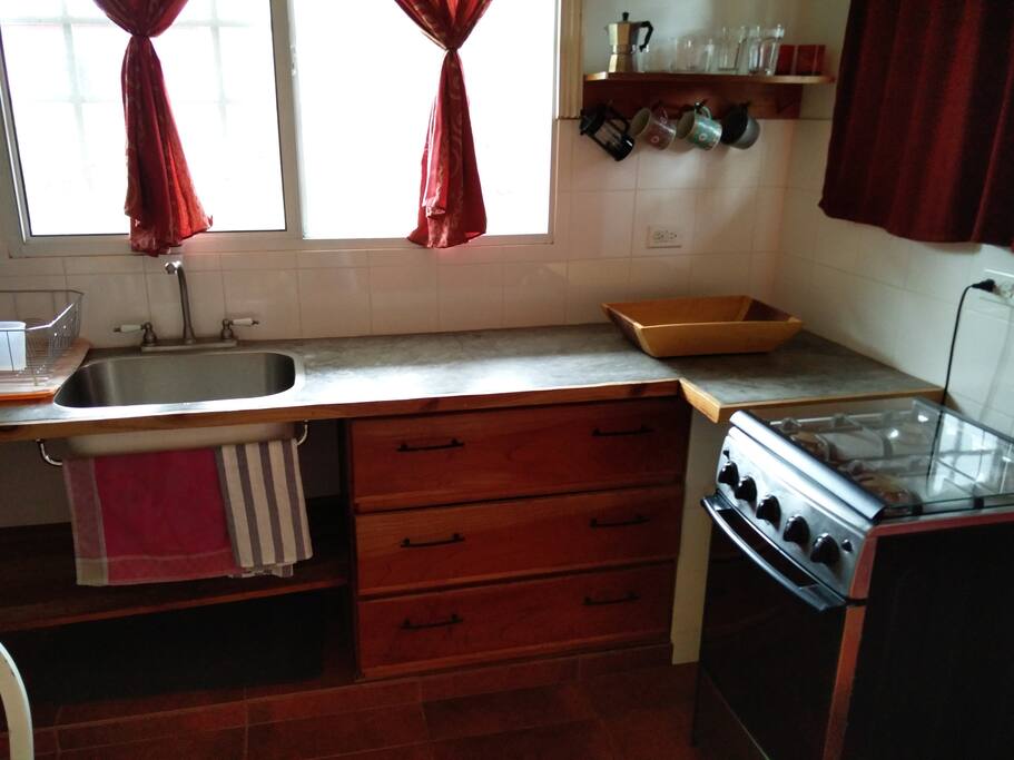 Full kitchen with stove and refridgerator