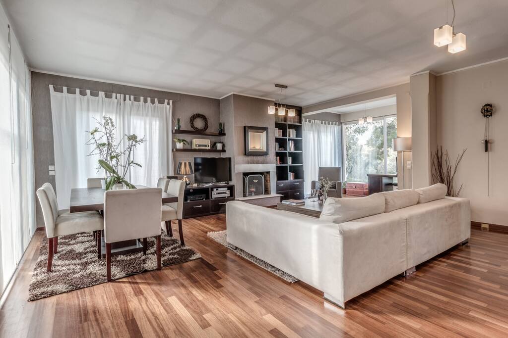 Open Plan Tv Room and Dining Room Overlooking Garden