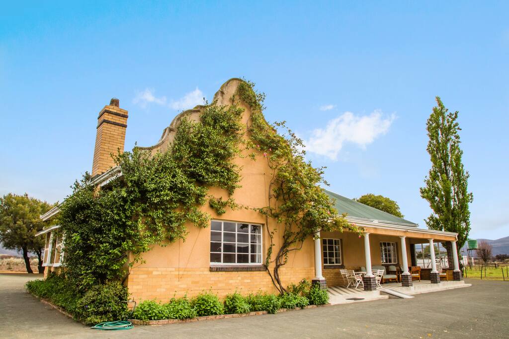 Front of cottage, with comfortable patio furniture