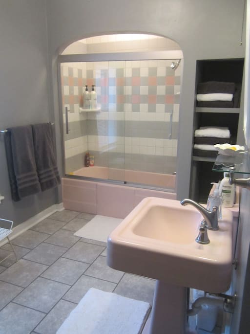Newly renovated bathroom with tub/shower, and plush towels to enhance your experience.