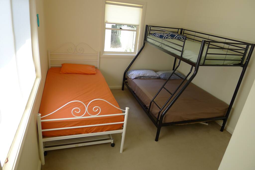The sleeping arrangement: one single and a bunk with a single and a double bed.