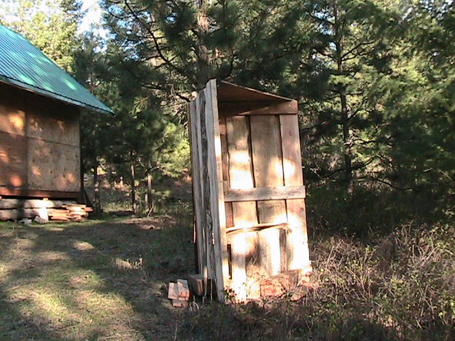 outdoor restroom there is no toilet inside rustic experience