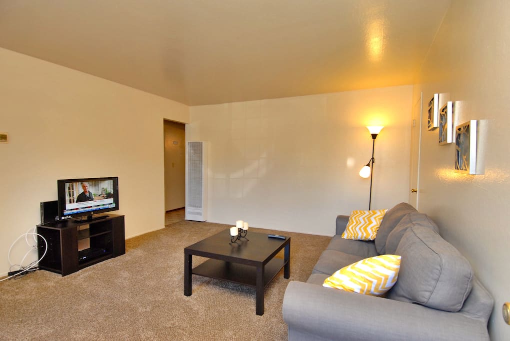 Spacious living room with cable television