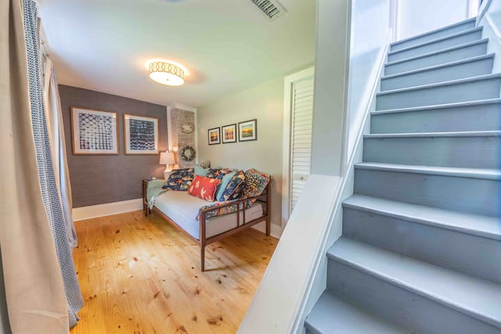 A twin daybed off of the front hall is perfect for afternoon naps or extra sleeping space.  It is a regular twin size mattress which will be made up upon request for guests to use. There is a closet and a beautiful view of the front yard.