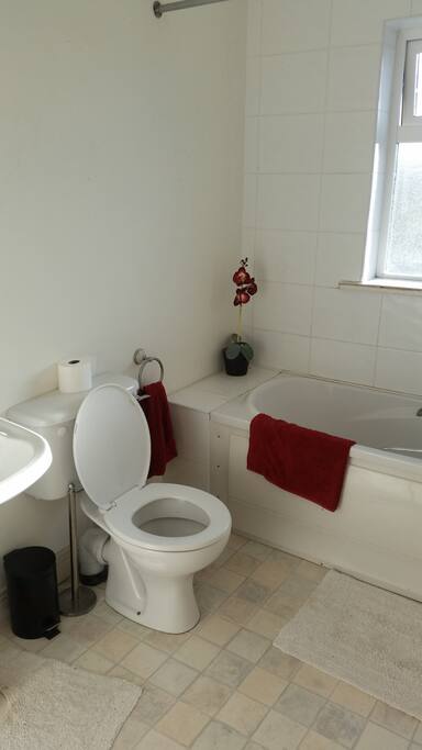 Bathroom with bath and shower