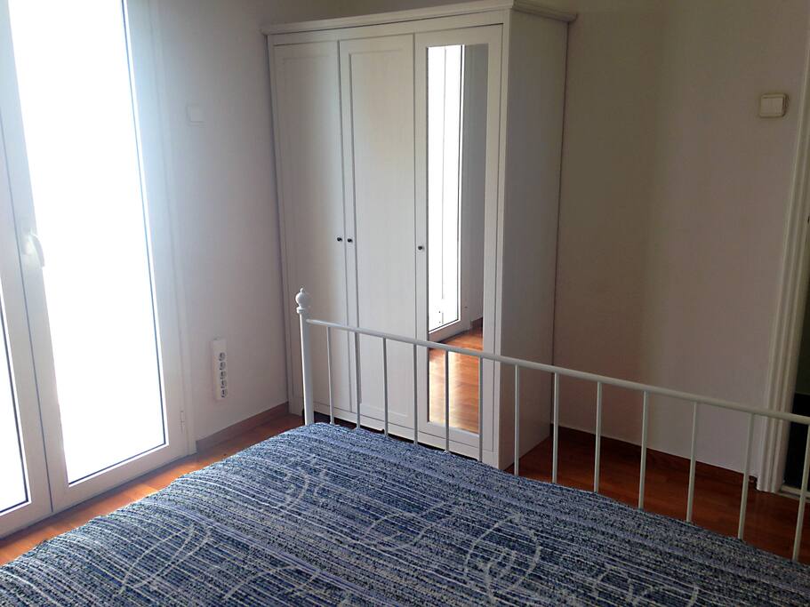 Different angle. Wardrobe with mirror.