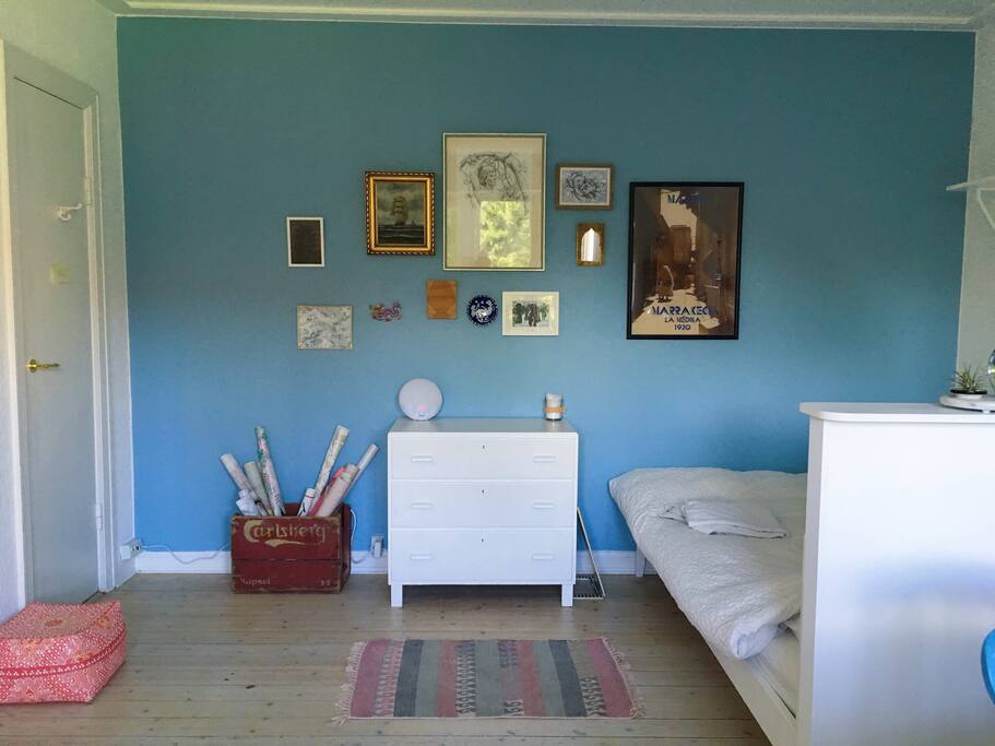 View of the dining area and bed from the balcony
