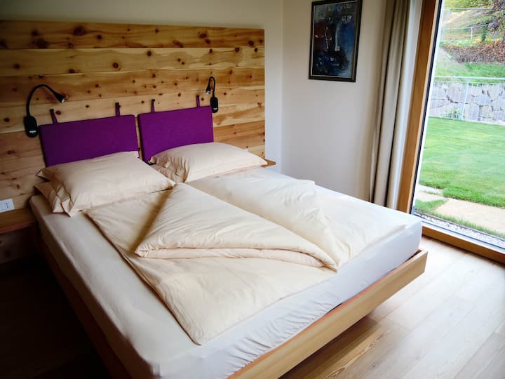 The double bed with real pine trees