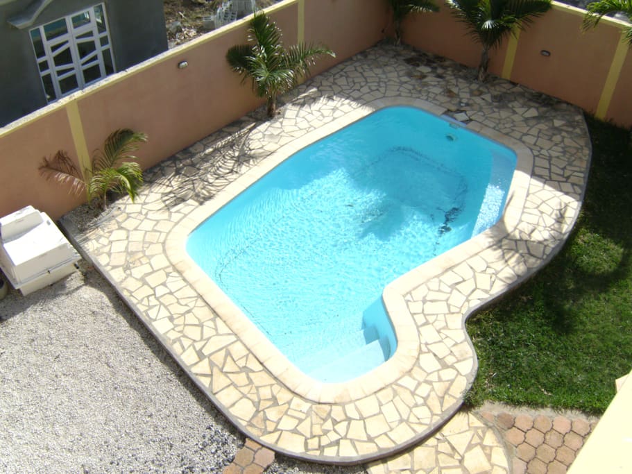 Private swimming pool in the front garden