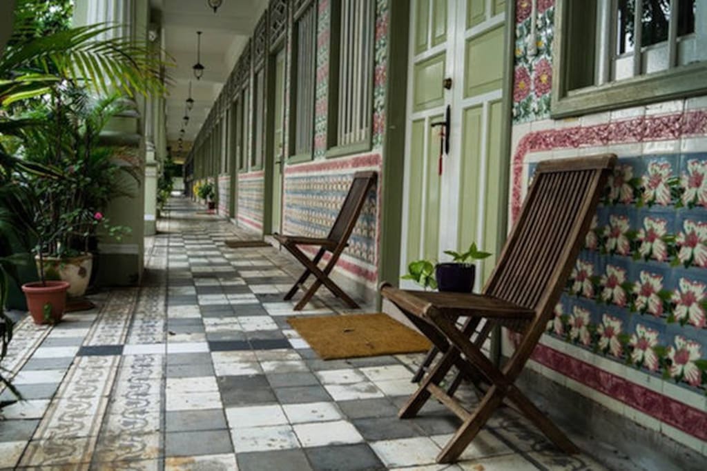 The elegant exterior walkway lined with beautiful vintage tiles and carvings.. :)