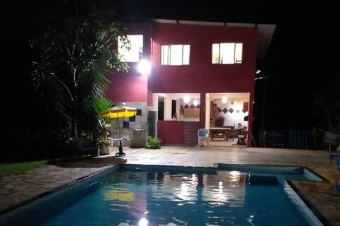 Heated pool place, lit and whirlpool.