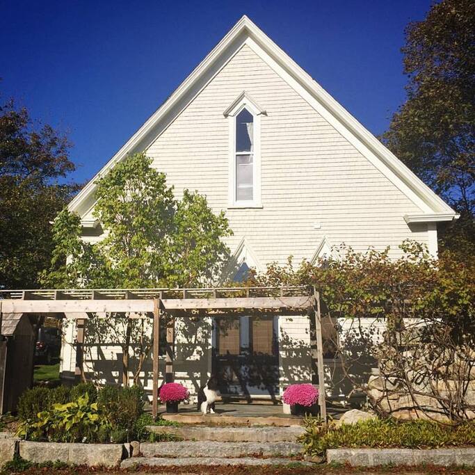 Front of the house from the street. Apartment entrance is in the back.