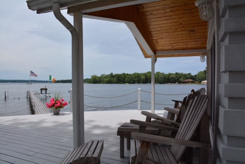 Spacious deck w/Adirondack chairs and umbrella w/seating for 6