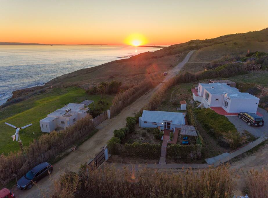 The 3 houses on the property at Sunset in winter.
