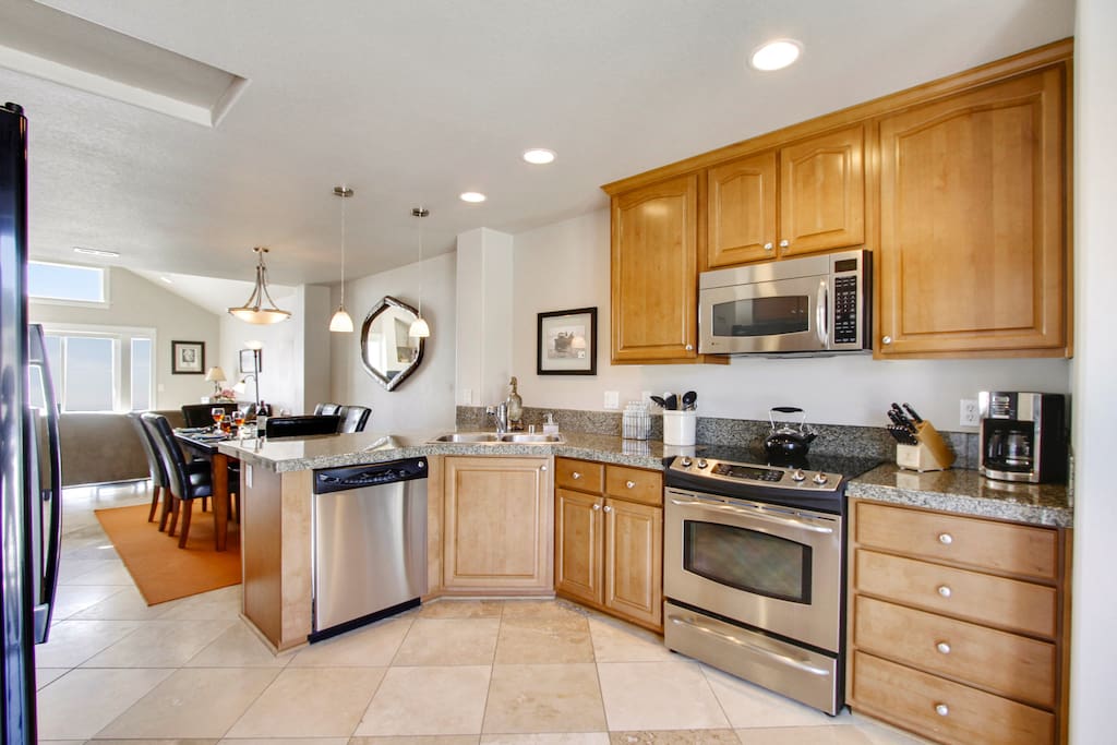 Large kitchen includes many chef's tools: blender, mixer, rice cooker, stock pot and more.