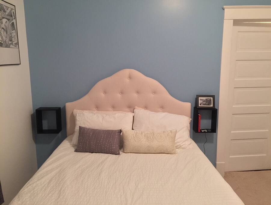 Queen size bed with brand new tufted headboard. Handmade wall box night stands.