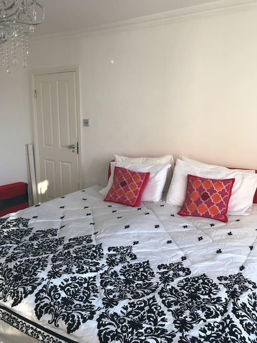 Large spacious bedroom accommodating two singles or 1 double bed