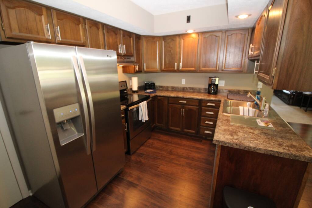 Kitchen, microwave, refrigerator, coffee maker, toaster, oven/range.